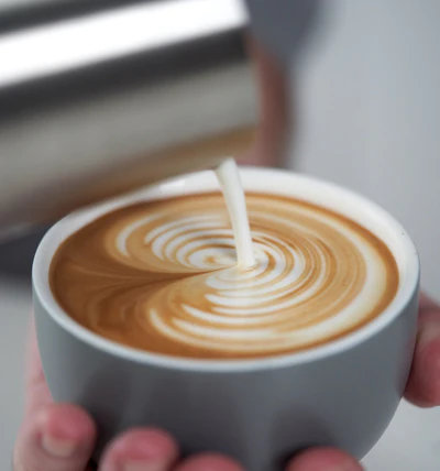 Pour NanoFoamer microfoamed milk over espresso for latte art